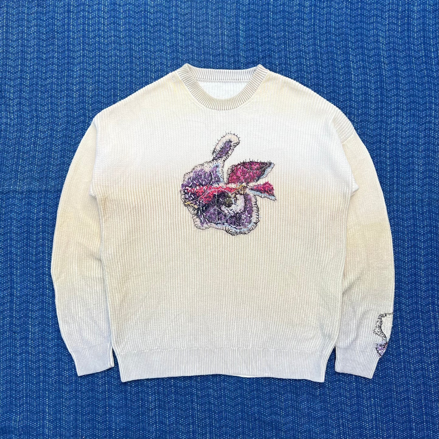 "Embroidered 'crew neck knit